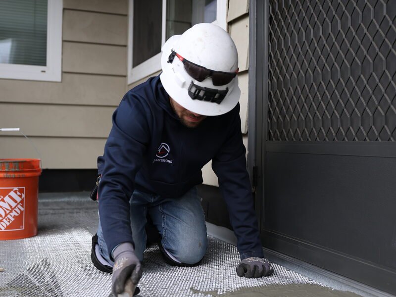 Professional waterproofing membrane installation on elevated deck