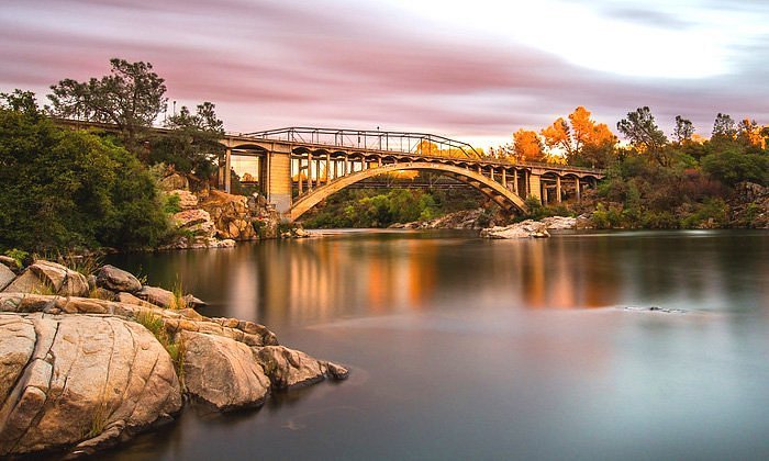 Rainbow Bridge over Lake Natoma in Folsom, CA at sunset — landmark in ABD Inspections deck and balcony service area for Folsom and El Dorado County HOAs