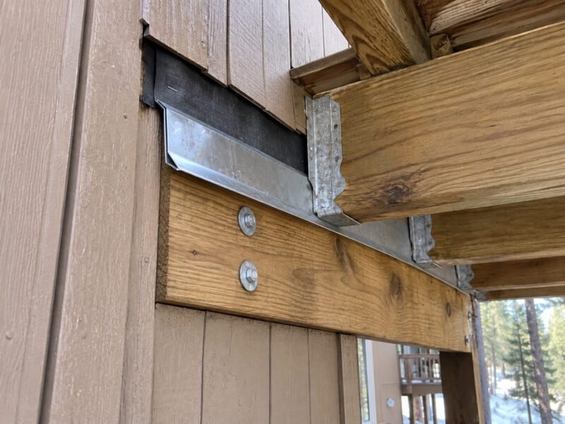 Re-flashed deck ledger with correctly lapped sheet metal in South Lake Tahoe