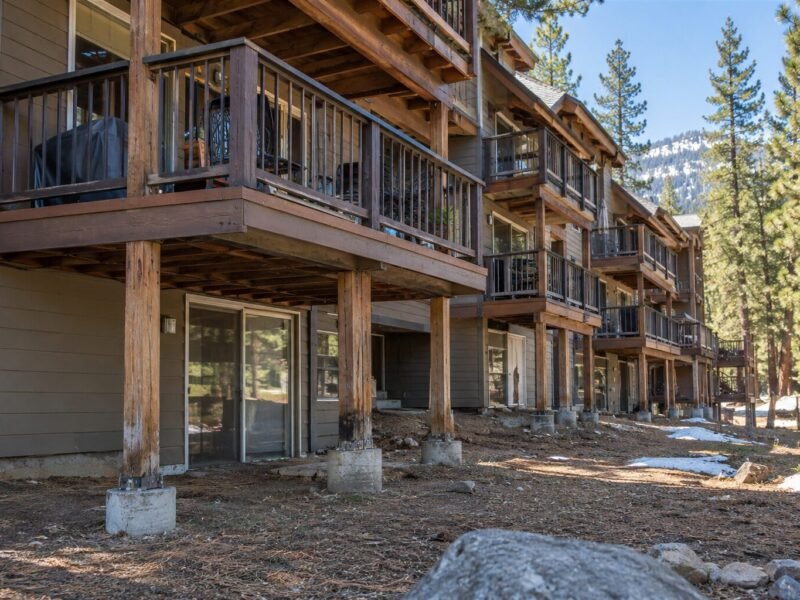 Timber deck posts and footings being rebuilt at a mountain apartment building in South Lake Tahoe, CA