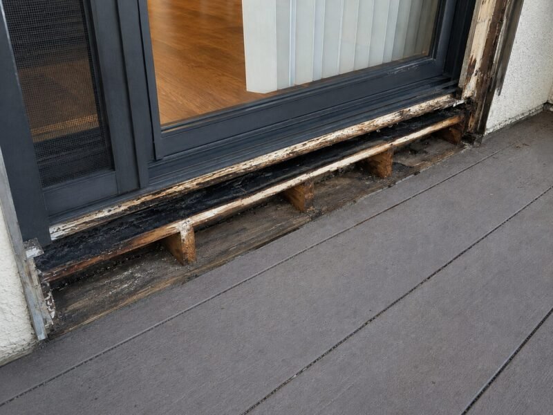 Balcony door threshold opened up during SB 721 leak repair at a Tracy apartment building